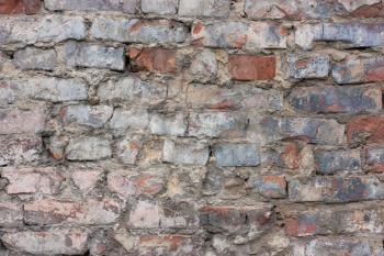 Old, brick, shabby wall.The long-standing surface