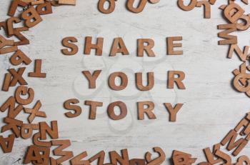 share your story It is written wooden letters