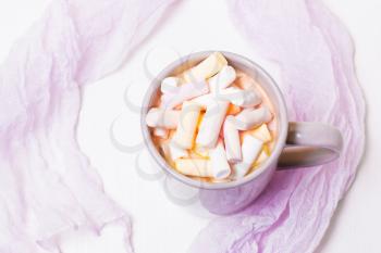 A mug of cocoa, coffee and marshmallows on a white background