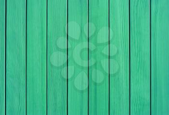green  Vertical  slats made of wood. Background from the fence, wall