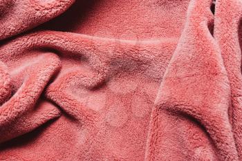 coral color of the year soft  fleece texture. The surface of a teddy crumpled microfiber rug