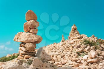 Balance of large stones on the beach, a mound. The concept of harmony, equilibrium, Zen