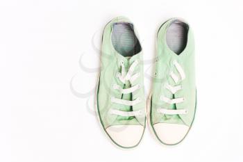 Old green sneakers, shoes. Concept of multiple trips, free life, tourism