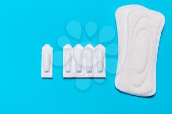 Medical, vaginal suppositories on a blue background, from candidiasis, thrush, sexually transmitted infections