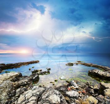 Rocks and sea storm. Dramatic scene. Composition of nature 