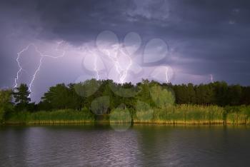 Lightning on the river. Nature composition.