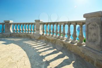 Beautiful seascape, view from stone balustrade on sunny summer day. Element of design.