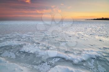 Winter landscape. Ice on water surface. Composition of nature.