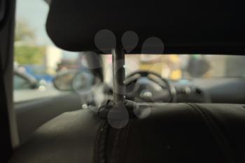 Driver's seat and close-up head restraint. Shallow depth of field compositoin.