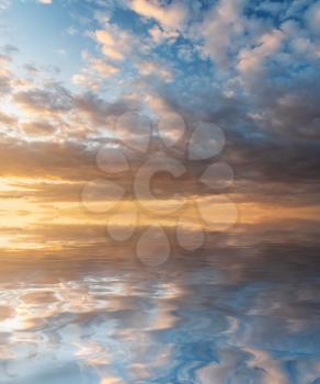 Sky background at sunset and water reflection. Nature composition.