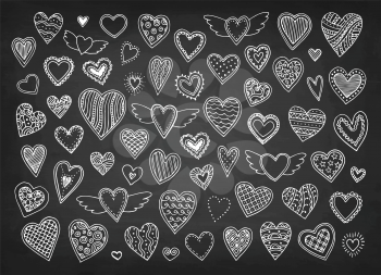 Cute doodle hearts. Chalk sketch on blackboard background. Hand drawn vector illustration. Retro style.