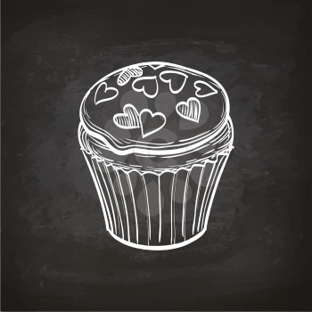 Glazed cupcake. Retro style sketch on chalkboard. Hand drawn vector illustration.