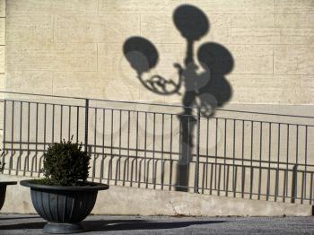 details of architecture, historical buildings of Italy. the shadow of a street lamp