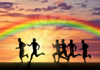 Runners, rainbow, sport. Runners on a rainbow background and sea sunset