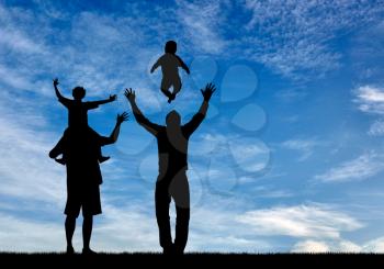 Concept of gay parents. Silhouette happy gay parents with children on the background of sky