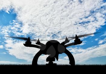 Silhouette drone taking off outdoors. Concept quadrocopters
