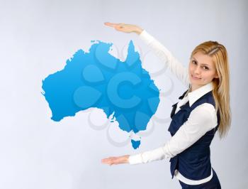 Business woman presentation of the continent of Australia. tourism and business concept