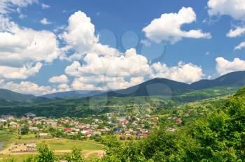 Mountain valley on a background of the rural landscape. Summer season