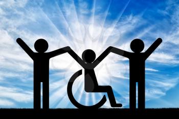 Happy disabled person in a wheelchair together with healthy people. Concept of support and assistance