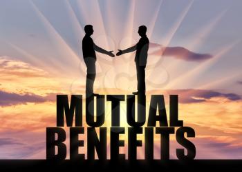 Silhouette two men are going to shake hands, standing on the word mutual benefit. Business concept of mutual benefit