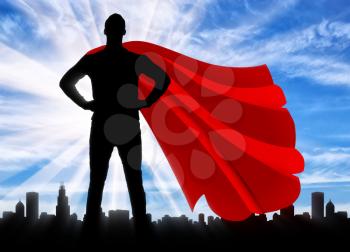 Superman businessman superhero. Silhouette of a confident and strong superman businessman against the backdrop of the metropolis city