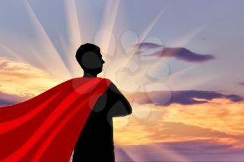 Superman businessman superhero. Silhouette of confident businessman superman looking at sunset