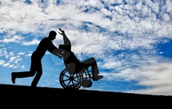 The merry time is spent by a disabled man in a wheelchair and his friend. Concept of leisure for disabled people