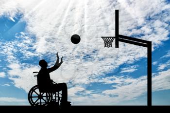 Disabled person playing basketball in a wheelchair. The concept of sports lifestyle people with disabilities