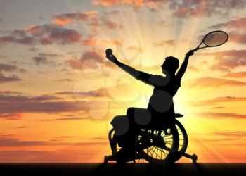 Silhouette of disabled person in a wheelchair playing tennis. The concept of disabled athletes