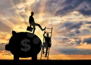 Silhouette of a businessman climbs the stairs, and another businessman standing with a piggy bank pushes this ladder. The concept of inequality and injustice