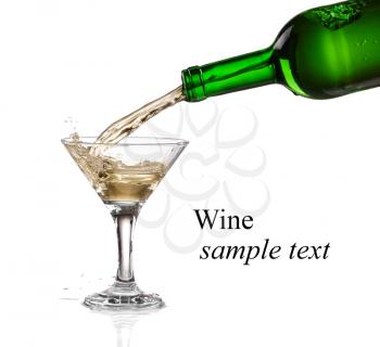 White wine pouring from the bottle intro the glass on white background(with sample text)