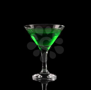 Green alcoholic cocktail in a glass on black