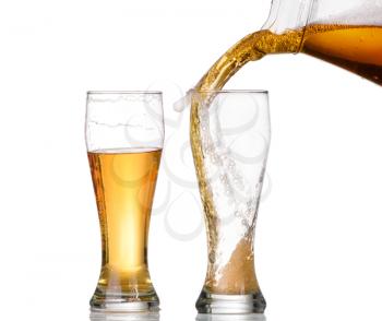 Chilled green bottle with condensate and a glass of beer lager on Isolated white background