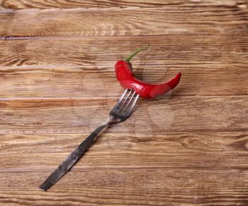 Chilli peppers and wood texture , background.