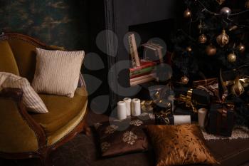 Decorated Christmas room with beautiful fir tree. Black and Gold