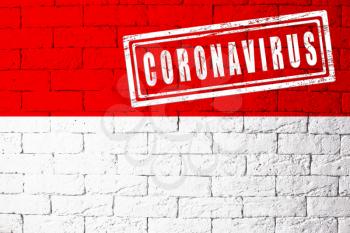 Flag of the regions of Germany Hesse with original proportions. stamped of Coronavirus. brick wall texture. Corona virus concept. On the verge of a COVID-19 or 2019-nCoV Pandemic.