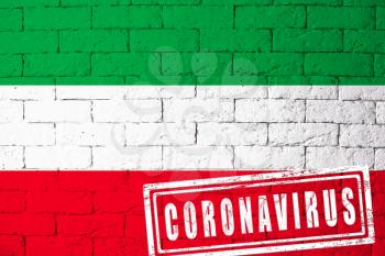 Flag of the regions of Germany North Rhine- with original proportions. stamped of Coronavirus. brick wall texture. Corona virus concept. On the verge of a COVID-19 or 2019-nCoV Pandemic.