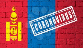 Flag of the Mongolia with original proportions. stamped of Coronavirus. brick wall texture. Corona virus concept. On the verge of a COVID-19 or 2019-nCoV Pandemic.