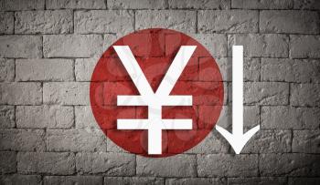 symbolic depreciation of the national currency Yen against of the country flag Japan. The concept of the depreciation of the currency, the fall of the economy and the breakdown of economic ties
