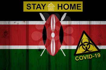 Flag of the Kenya in original proportions. Quarantine and isolation - Stay at home. flag with biohazard symbol and inscription COVID-19.