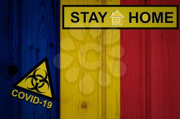 Flag of the Romania in original proportions. Quarantine and isolation - Stay at home. flag with biohazard symbol and inscription COVID-19.