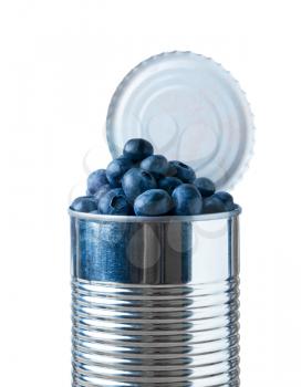 Blueberry fruit heaped inside opened tin can container in concept of fresh food coming in cans