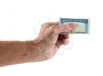 Hand and arm of senior caucasian adult holding and offering a social security card in a cutout isolated against white background