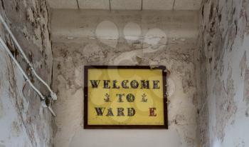 Painted sign to Ward E inside Trans-Allegheny Lunatic Asylum in Weston, West Virginia, USA