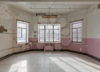 Empty room with windows inside Trans-Allegheny Lunatic Asylum in Weston, West Virginia, USA