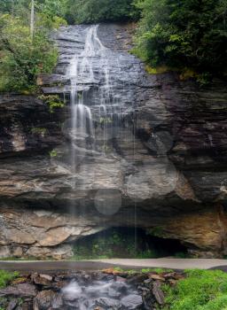 Bridal Veil Falls waterfall with blurred motion cascading down the rocks near Highlands on Mountain Water Scenic Byway in North Carolina, USA