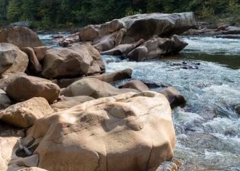 View of smoothed boulders in the rapids of Cheat River in canyon downstream of Albright
