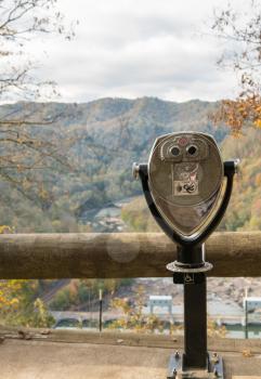 Close up of disabled wheelchair accessible coin operated binoculars or telescope at Hawks Nest State Park in fall colors