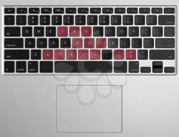 Laptop computer keyboard spelling out April 18 2017 as Tax Day
