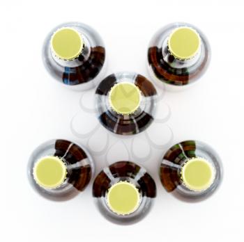Pattern of six beer bottles with gold caps facing upwards and making a smiley face